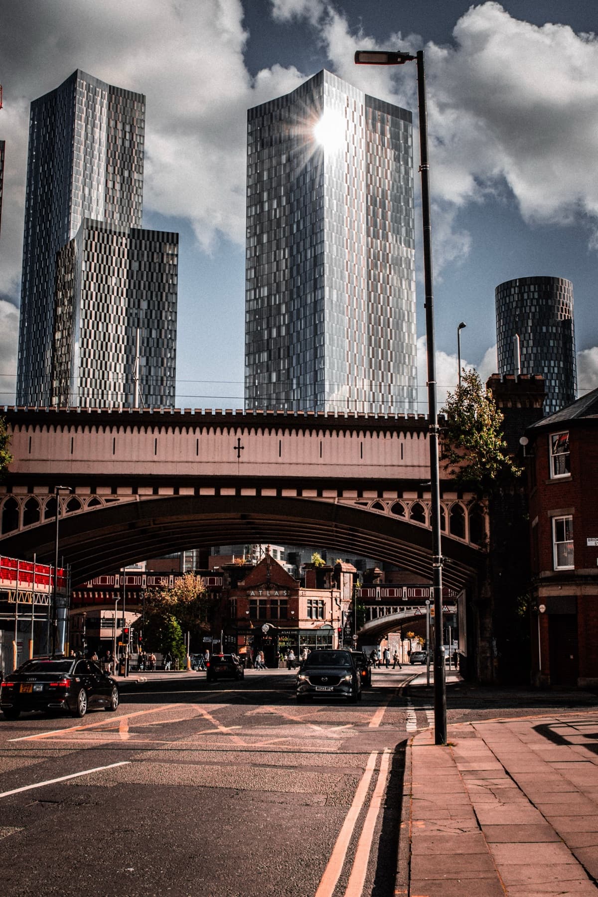 A city bridge with modern towers beyond