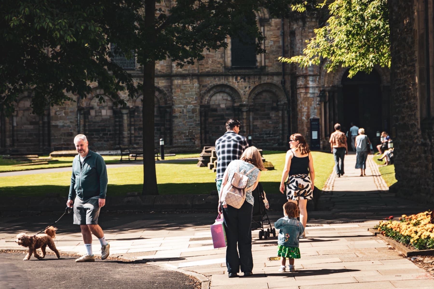 People and families moving through a British city centre