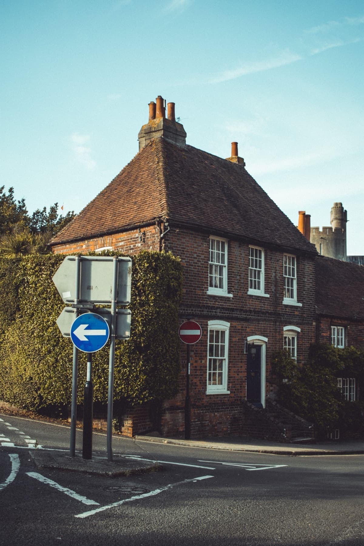 Traditional brick home at a road junction