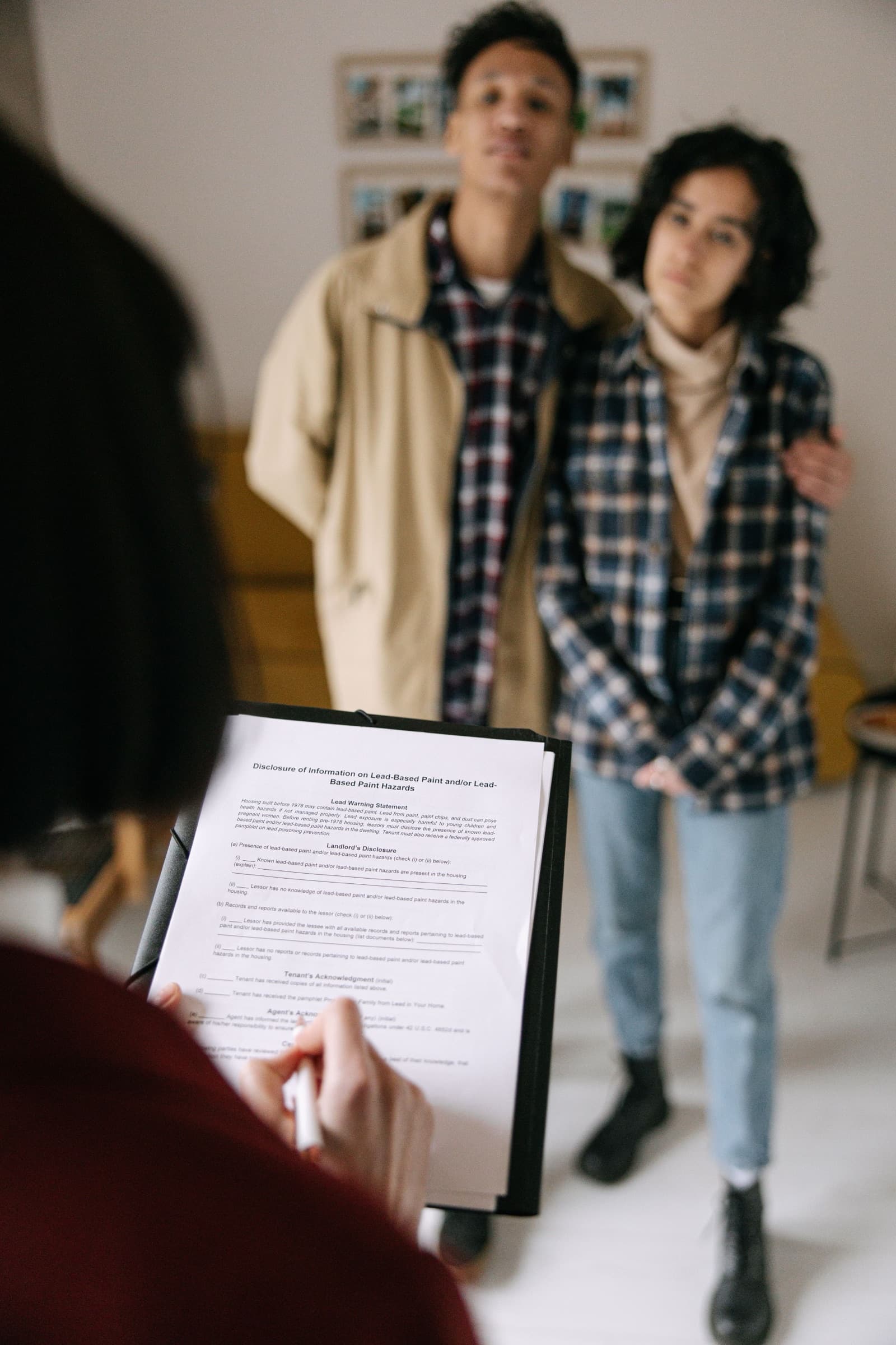 A property buyer reviewing transaction documents with an adviser